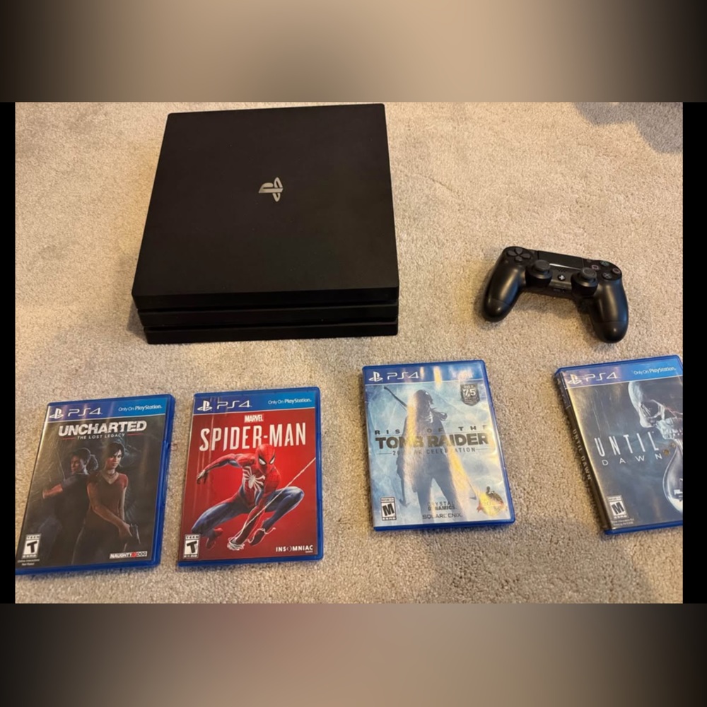 PS4 console, controller and 4 games.